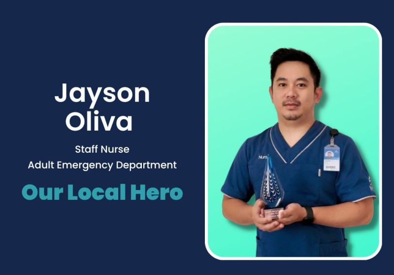 A nurse holding an award