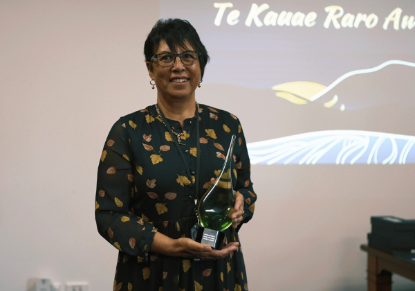 a person holding an award